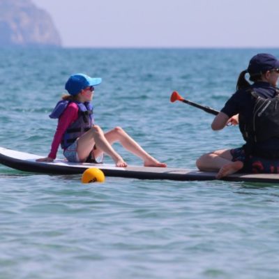 Mum and child paddleboard