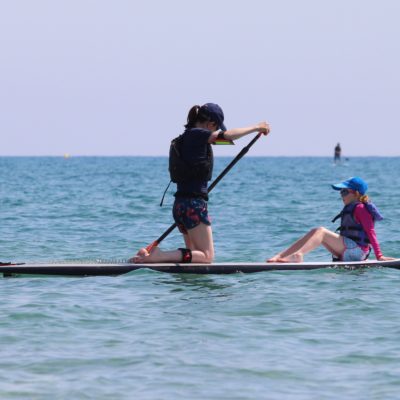 Mum and child paddleboard